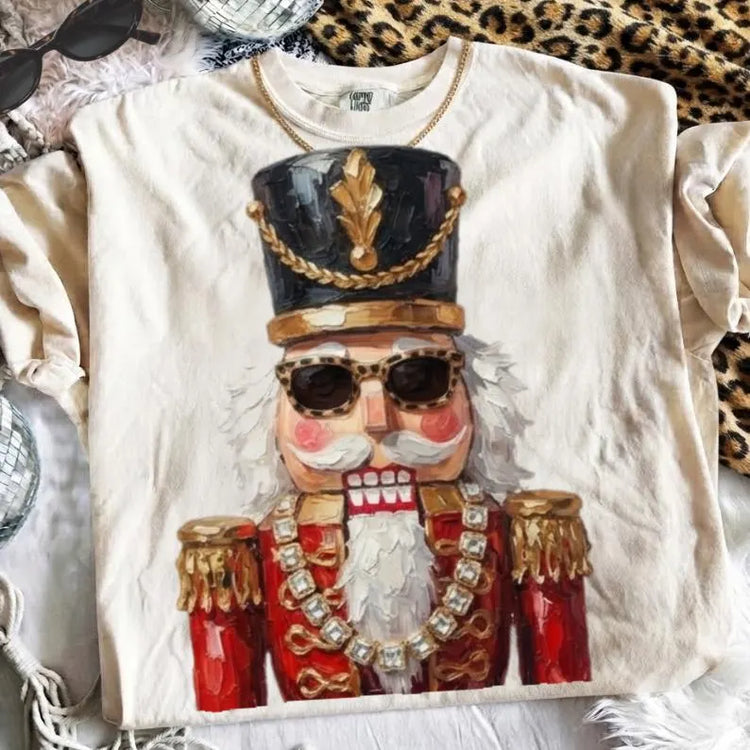 Glam Nutcracker on Ivory Christmas Comfort Colors Graphic Tee